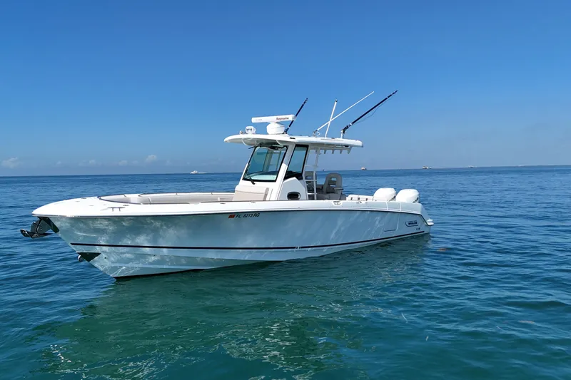 The Image of 2017 Boston Whaler 330 Outrage boat on calm blue ocean waters. - 0