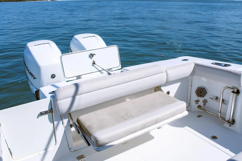 Slide: The Image of 2017 Boston Whaler 330 Outrage boat with twin Mercury engines on calm water. - 10