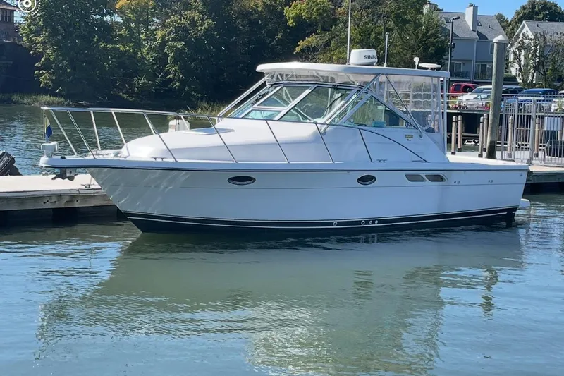 The Image of 2005 Tiara Yachts 2900 Open docked in a serene marina setting. - 0