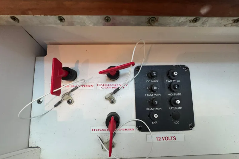 Slide: The Image of Control panel of a 2005 Tiara Yachts 2900 Open, featuring battery switches and circuit breakers. - 16