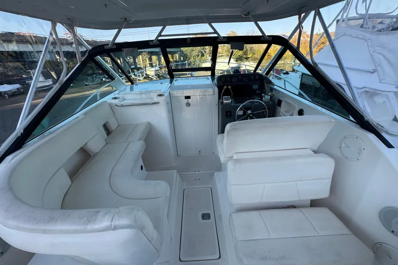 Slide: The Image of 2005 Tiara Yachts 2900 Open interior with white seating and helm station. - 7