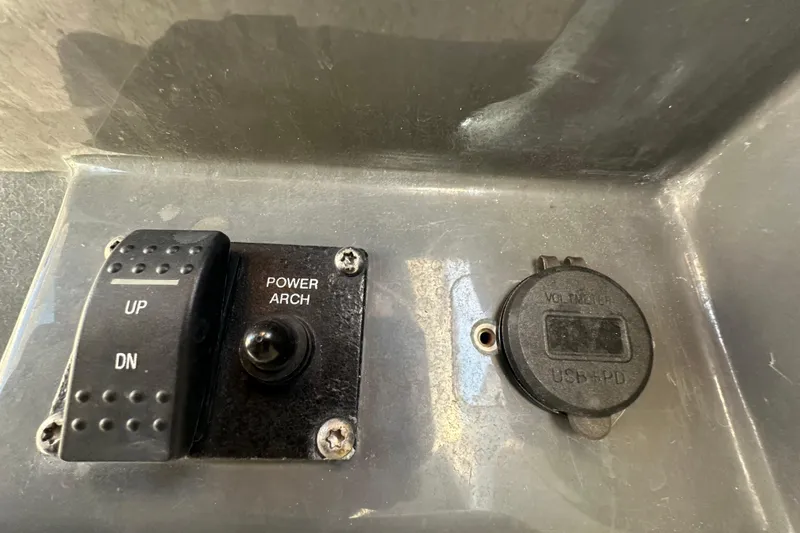 Slide: The Image of Control panel of 2014 Larson Cabrio 265 boat with power arch switch and USB port. - 22