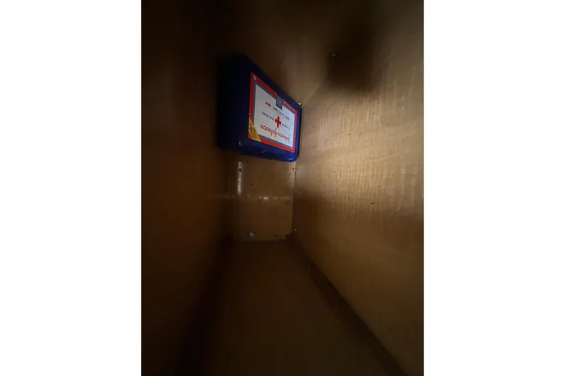 Slide: The Image of First aid kit inside a 2014 Larson Cabrio 265 boat compartment. - 36