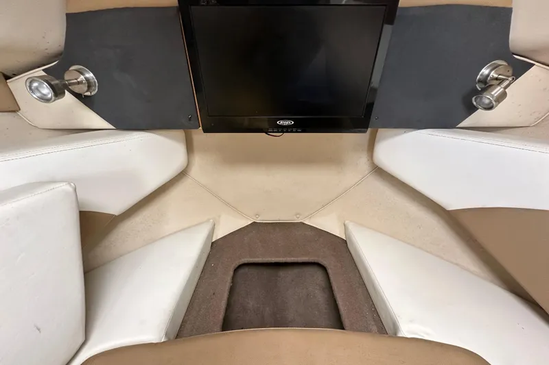 Slide: The Image of Interior of 2014 Larson Cabrio 265 boat with seating and mounted screen. - 37