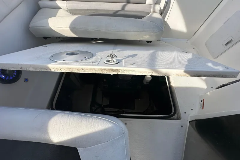 Slide: The Image of 2014 Larson Cabrio 265 boat interior with open engine compartment. - 67