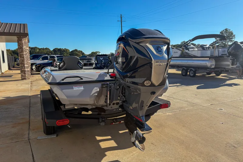 Slide: The Image of 2026 Skeeter ZXR20 SE boat with Yamaha engine, parked outdoors on a sunny day. - 4