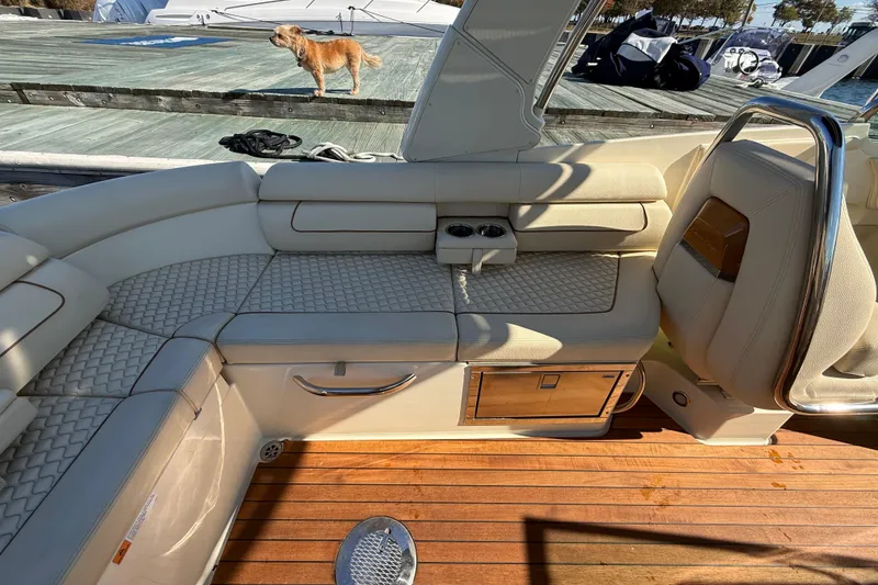 Slide: The Image of Luxurious interior of 2019 Chris-Craft Launch 28 GT with elegant seating and wooden flooring. - 13