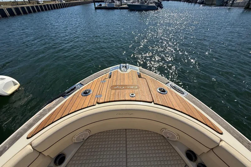 Slide: The Image of 2019 Chris-Craft Launch 28 GT boat with teak deck on sparkling water. - 22
