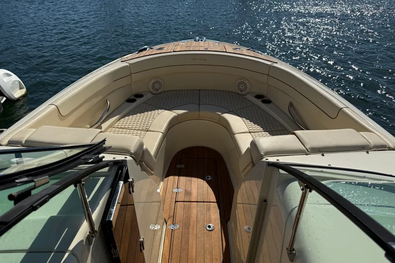 Slide: The Image of 2019 Chris-Craft Launch 28 GT boat interior with elegant seating and wooden deck. - 27
