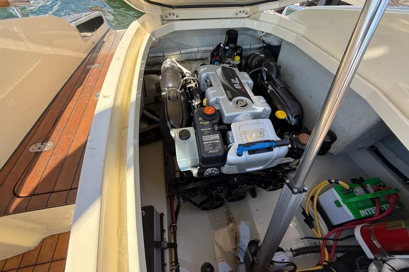 Slide: The Image of Engine compartment of 2019 Chris-Craft Launch 28 GT boat, showcasing powerful V8 engine. - 31