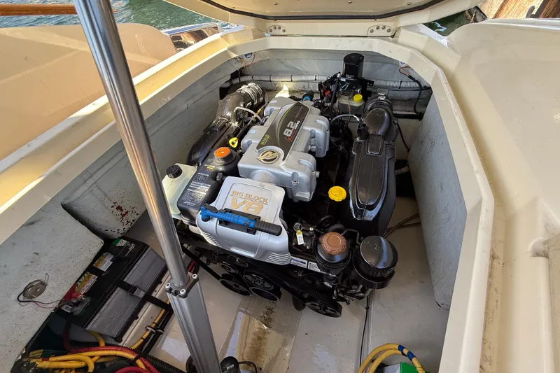Slide: The Image of Engine compartment of 2019 Chris-Craft Launch 28 GT with V8 engine visible. - 32