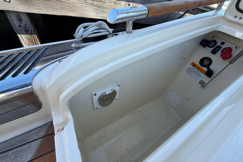 Slide: The Image of 2019 Chris-Craft Launch 28 GT boat interior with control panel and storage compartment. - 4