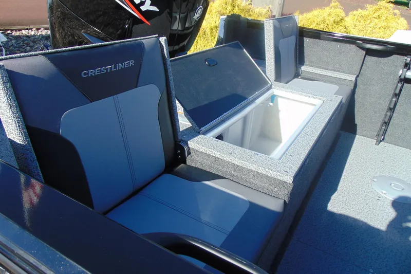 Slide: The Image of 2026 Crestliner 1750 Hawk boat interior with seating and storage compartment. - 6
