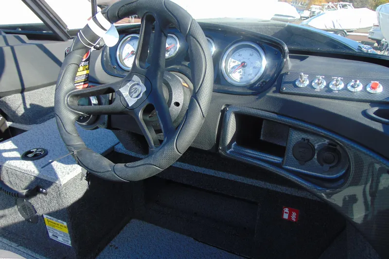 Slide: The Image of Dashboard of 2026 Crestliner 1750 Hawk boat with steering wheel and gauges. - 9