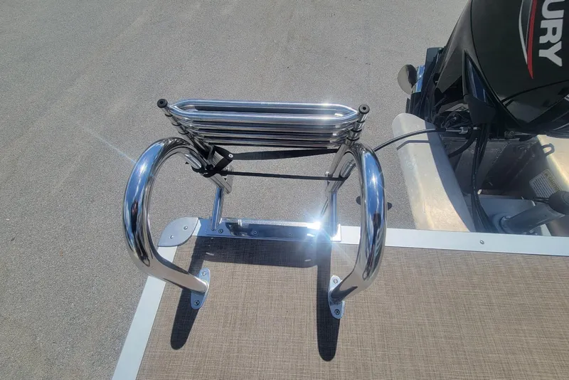 Slide: The Image of 2023 Sun Tracker Party Barge 20 DLX boat ladder and Mercury engine detail. - 15