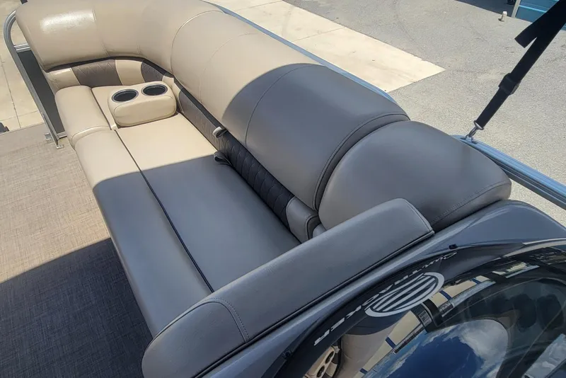 Slide: The Image of 2023 Sun Tracker Party Barge 20 DLX, featuring comfortable seating with cup holders. - 22
