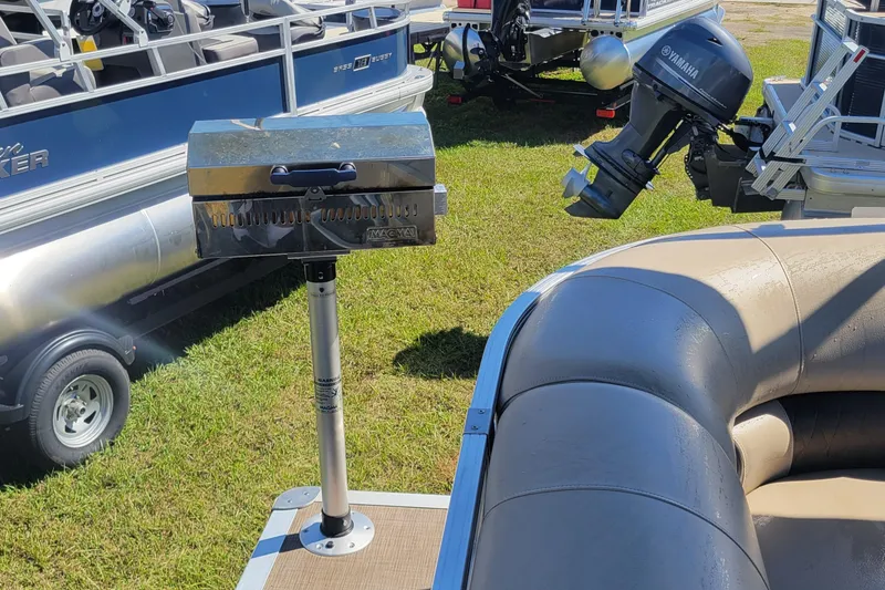 Slide: The Image of 2023 Sun Tracker Party Barge 20 DLX with mounted grill and Yamaha motor. - 7