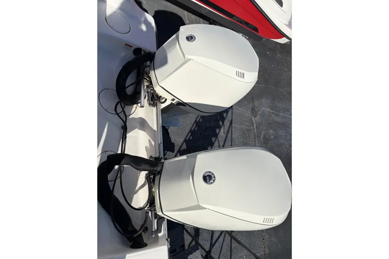 Slide: The Image of Twin outboard motors on a 2006 Mako 284 Center Console boat. - 6