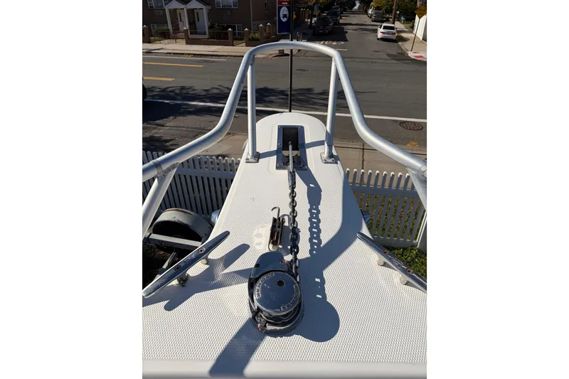 Slide: The Image of 2006 Mako 284 Center Console boat bow with anchor chain and railing. - 9