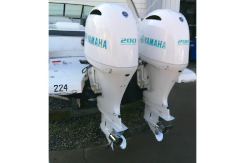 Slide: The Image of Twin Yamaha 200 outboard engines on a 2022 Regal 29 OBX boat. - 10