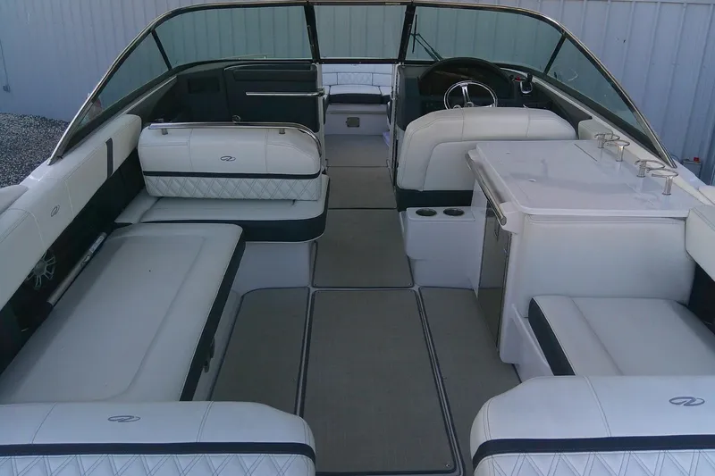 Slide: The Image of 2022 Regal 29 OBX boat interior with luxurious seating and modern design. - 12