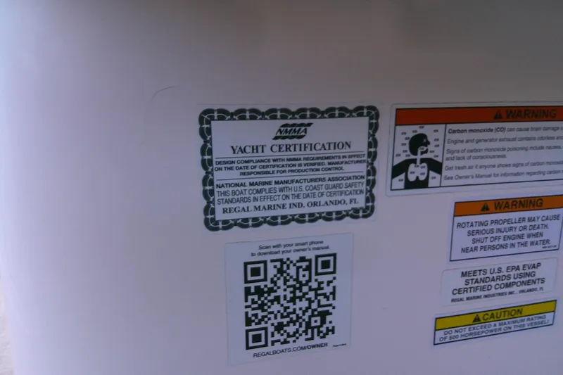 Slide: The Image of 2022 Regal 29 OBX yacht certification and safety warnings with QR code for owner information. - 16