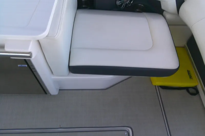 Slide: The Image of 2022 Regal 29 OBX boat interior with white seating and sleek design. - 18