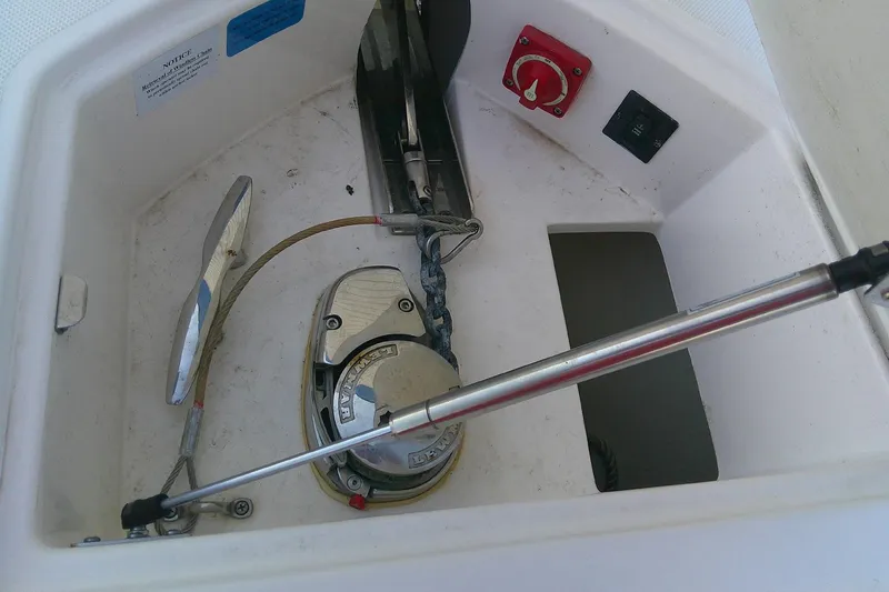 Slide: The Image of Anchor compartment of 2022 Regal 29 OBX boat with winch and chain. - 19