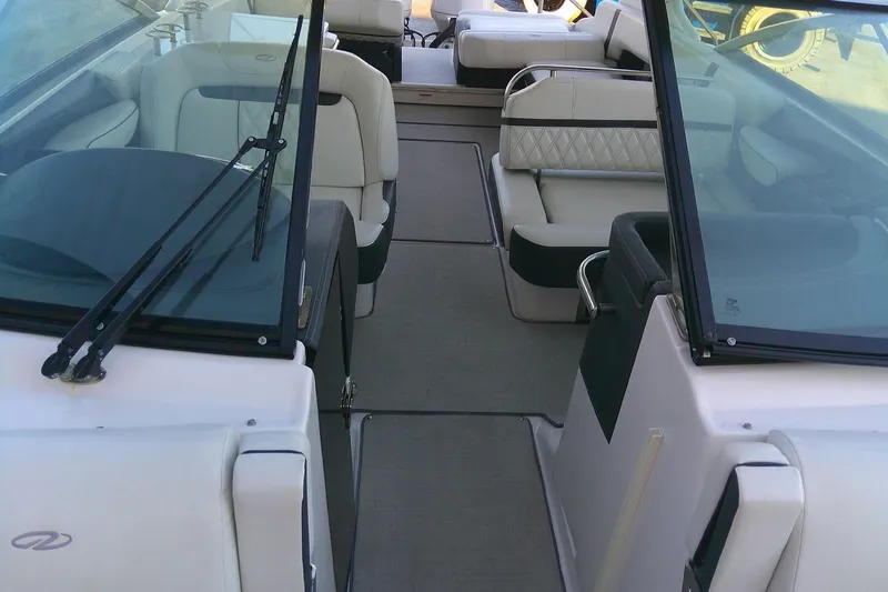 Slide: The Image of 2022 Regal 29 OBX boat interior with luxurious seating and sleek design. - 20