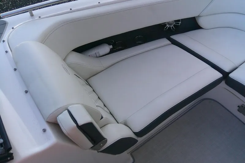 Slide: The Image of 2022 Regal 29 OBX boat interior with white cushioned seating. - 23