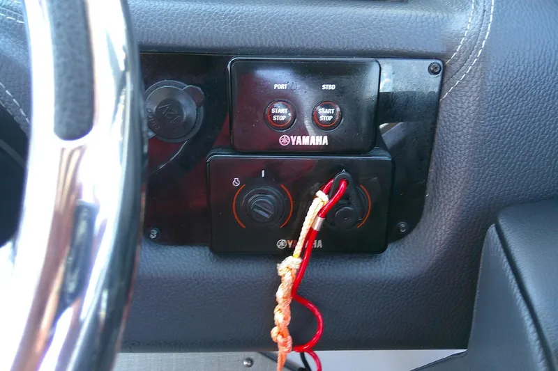 Slide: The Image of Dashboard of 2022 Regal 29 OBX boat with Yamaha controls and steering wheel. - 26