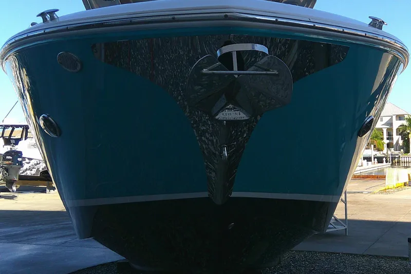 Slide: The Image of 2022 Regal 29 OBX boat front view in a marina setting. - 8