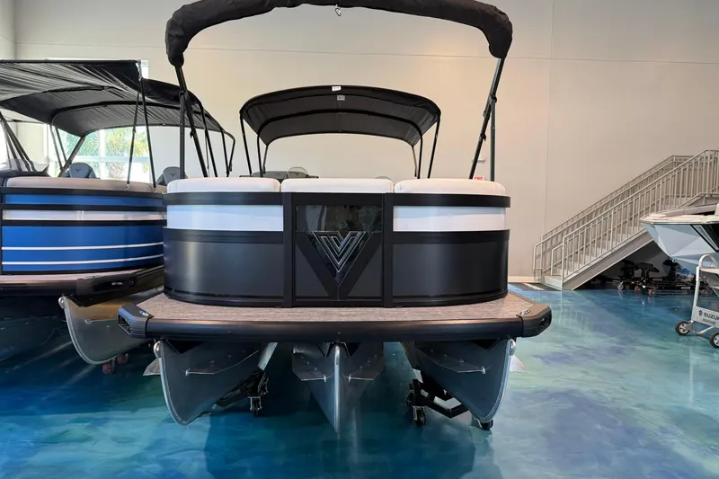 Slide: The Image of Viaggio Diamante Q 2026 pontoon boat displayed indoors, showcasing sleek design and modern features. - 1