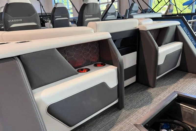 Slide: The Image of Interior of 2026 Viaggio Diamante Q boat with modern seating and cup holders. - 13