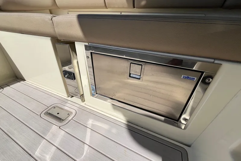Slide: The Image of 2022 Chris-Craft Launch 35 GT I/O interior with built-in stainless steel cooler. - 15