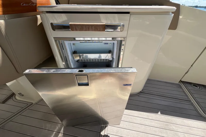 Slide: The Image of 2022 Chris-Craft Launch 35 GT I/O boat with open stainless steel refrigerator. - 17