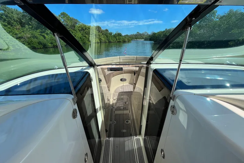 Slide: The Image of 2022 Chris-Craft Launch 35 GT I/O interior with scenic waterway view. - 23