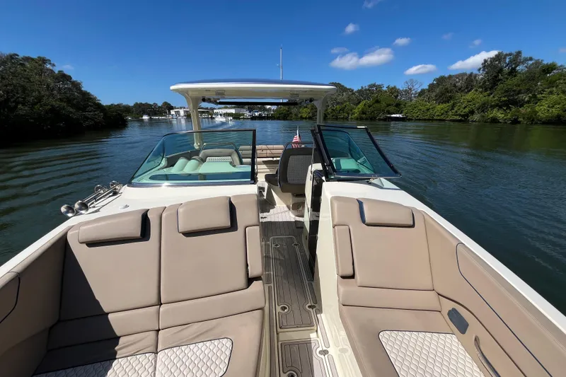 Slide: The Image of 2022 Chris-Craft Launch 35 GT I/O boat cruising on a scenic river. - 25