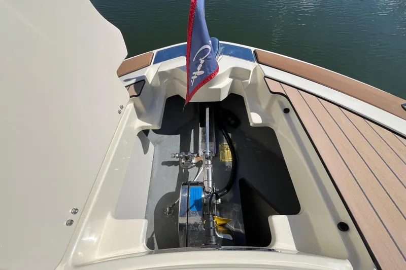 Slide: The Image of 2022 Chris-Craft Launch 35 GT I/O boat stern with flag and storage compartment. - 30