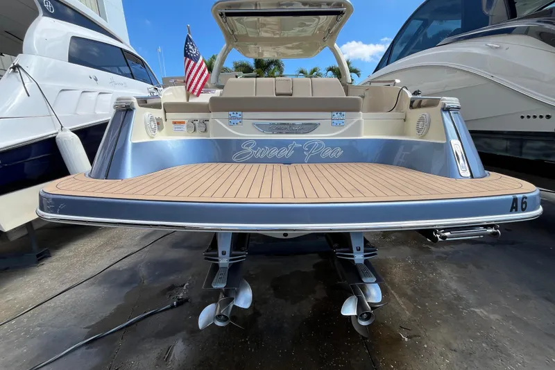 Slide: The Image of 2022 Chris-Craft Launch 35 GT I/O boat with teak deck and American flag. - 9