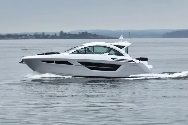 The Image of 2024 Cruisers Yachts 50 Cantius cruising on calm waters. - 0
