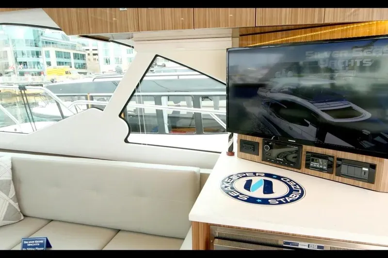 Slide: The Image of Interior of 2024 Cruisers Yachts 50 Cantius with TV and seating area. - 18