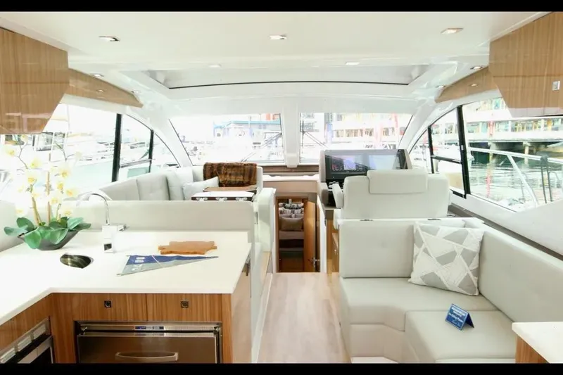 Slide: The Image of Luxurious interior of 2024 Cruisers Yachts 50 Cantius with modern seating and elegant design. - 19