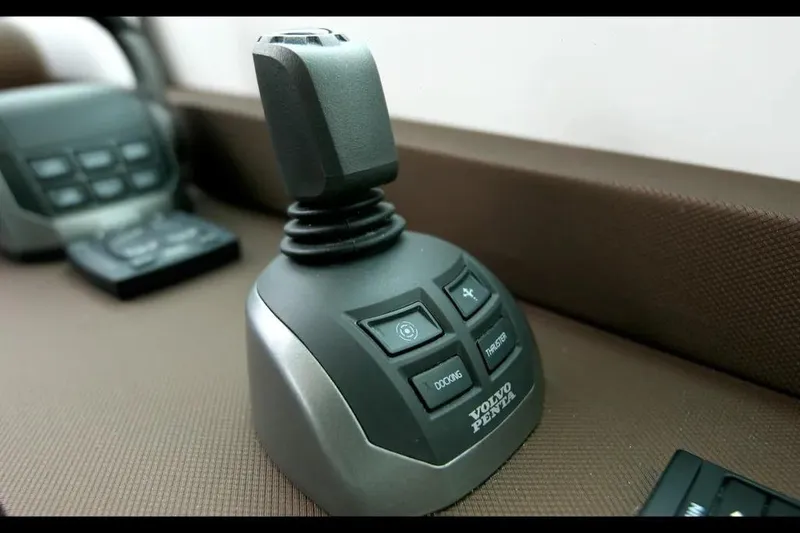 Slide: The Image of Joystick control panel on 2024 Cruisers Yachts 50 Cantius, featuring Volvo Penta technology. - 27