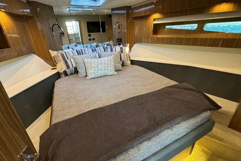 Slide: The Image of Luxurious bedroom interior of 2024 Cruisers Yachts 50 Cantius with modern design and cozy bedding. - 32