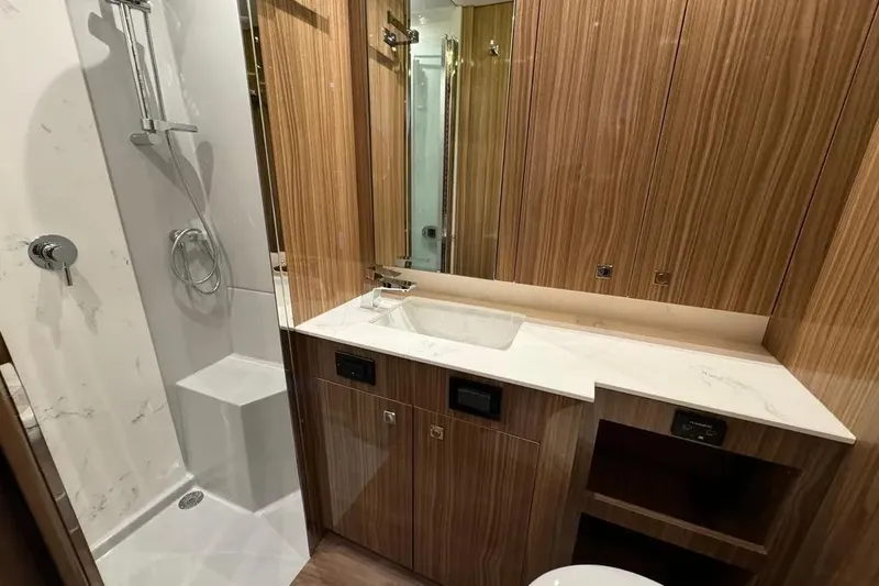 Slide: The Image of Luxurious bathroom in 2024 Cruisers Yachts 50 Cantius with wood accents and modern fixtures. - 44