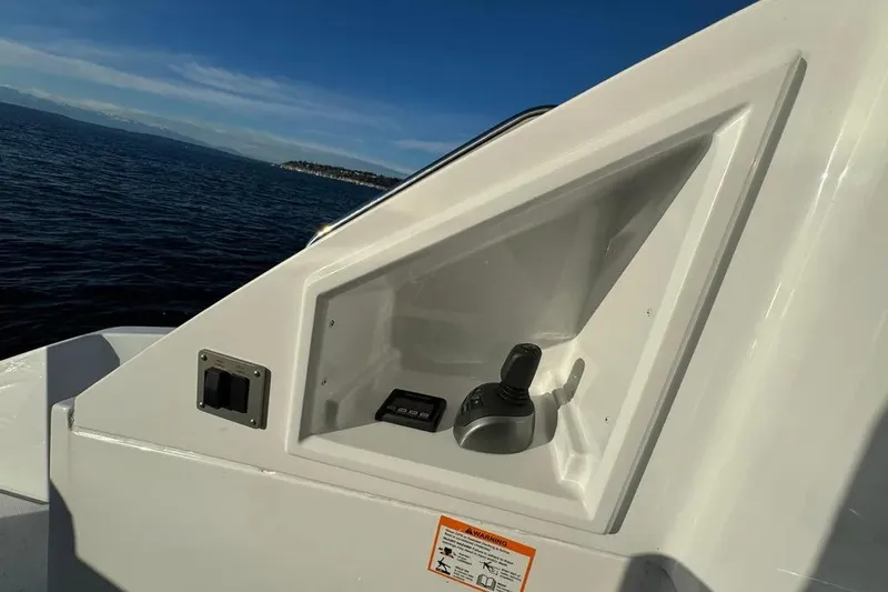 Slide: The Image of 2024 Cruisers Yachts 50 Cantius control panel with joystick, ocean view in background. - 47
