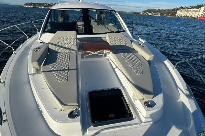 Slide: The Image of 2024 Cruisers Yachts 50 Cantius deck with luxurious seating and ocean view. - 49