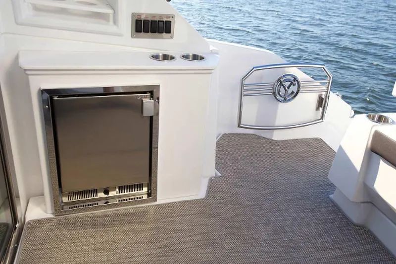 Slide: The Image of 2024 Cruisers Yachts 50 Cantius deck with mini fridge and ocean view. - 10