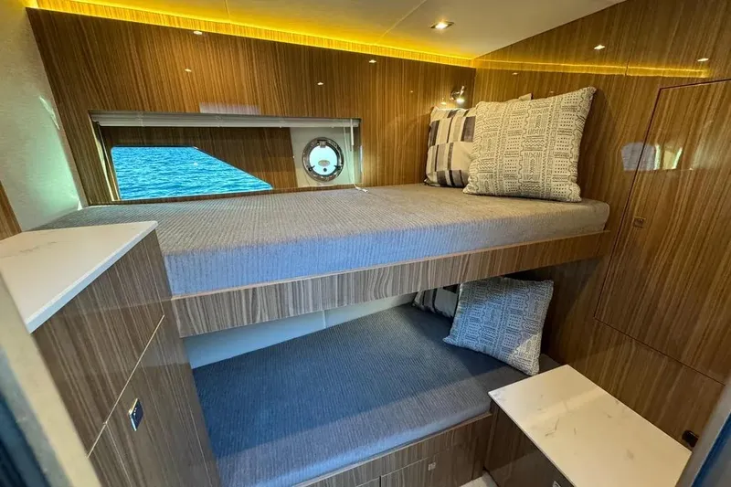Slide: The Image of 2024 Cruisers Yachts 50 Cantius cabin with bunk beds and modern wood finish. - 38